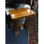 A YEW WOOD NEST OF THREE TABLES AND A MAHOGANY OVAL TABLE