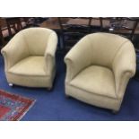 A PAIR OF UPHOLSTERED TUB CHAIRS