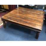 A STAINED WOOD COFFEE TABLE