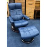 A STRESSLESS BLUE RECLINER CHAIR AND MATCHING STOOL