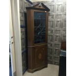 AN EARLY 19TH CENTURY INLAID MAHOGANY CORNER DISPLAY CABINET