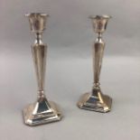 A PAIR OF SILVER CANDLESTICKS