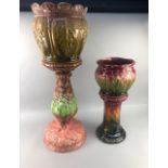 A VICTORIAN MAJOLICA JARDINIERE AND STAND AND ANOTHER