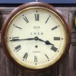 A REPRODUCTION STATION WALL CLOCK