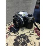 AN OLYMPUS OM10 CAMERA AND OTHER CAMERAS AND ACCESSORIES