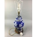 A BLUE AND WHITE CERAMIC TABLE LAMP AND THREE OTHERS