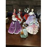 A ROYAL DOULTON FIGURE OF 'CHRISTMAS DAY' AND SIX OTHER ROYAL DOULTON FIGURES