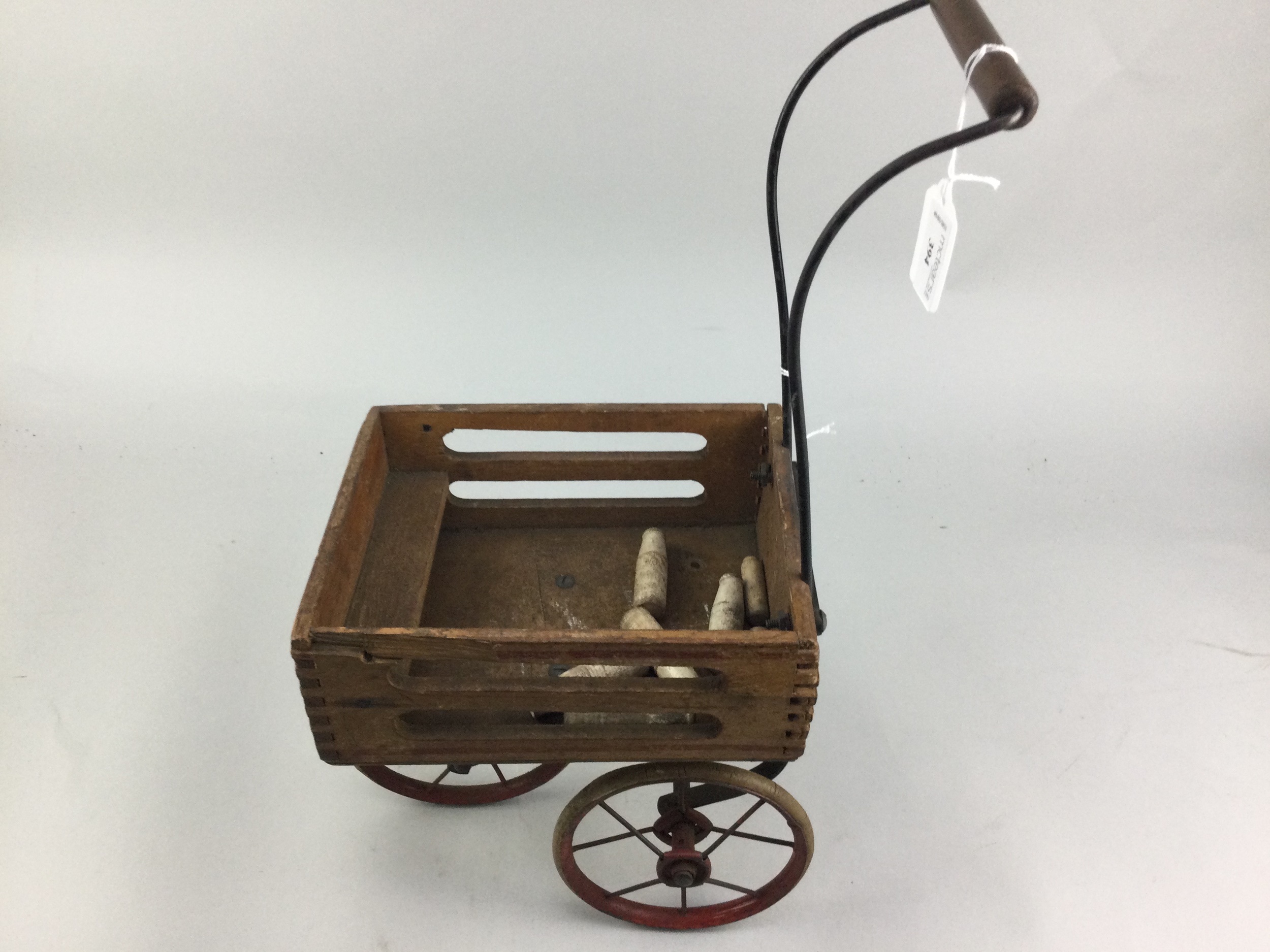 AN EARLY 20TH CENTURY TRI-ANG MODEL DAIRY CART