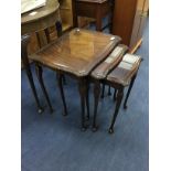 A MAHOGANY NEST OF THREE TABLES AND AN OAK D SHAPED HALL TABLE