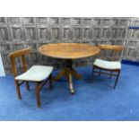 A STAINED WOOD CIRCULAR DINING TABLE AND FOUR CHAIRS