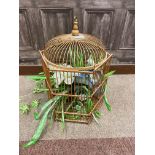 A HEXAGONAL CANE BIRD CAGE