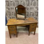 AN OAK DESK AND A DRESSING TABLE MIRROR