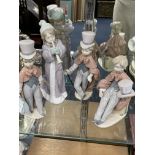 A LLADRO FIGURE OF A GIRL PLAYING A HORN AND THREE OTHERS