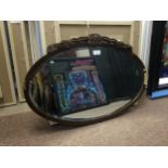 A CARVED WOOD FRAMED OVAL WALL HANGING MIRROR AND ANOTHER TWO MIRRORS