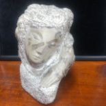 A SCULPTED STONE HEAD BY JAMES GOODBAND