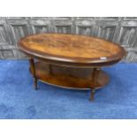 A REPRODUCTION MAHOGANY OVAL TWO TIER OCCASIONAL TABLE