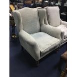 A MODERN WINGBACK ARMCHAIR AND ANOTHER