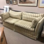 A MODERN CREAM AND GOLD UPHOLSTERED THREE SEAT SETTEE