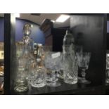 A GROUP OF GLASS DECANTERS AND DRINKING GLASSES