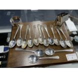 A SET OF EIGHT SILVER GOLFING TEA SPOONS ALONG WITH OTHER SILVER AND PLATED WARE