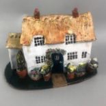A STUDIO POTTERY FIGURE OF A COTTAGE AND OTHER CERAMICS
