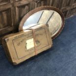 A 20TH CENTURY MAHOGANY OVAL WALL MIRROR AND A VINTAGE LAUNDRY BOX