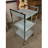 A MODERN THREE TIER TROLLEY AND A PAIR OF PORADA DINING CHAIRS
