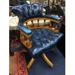 A MODERN LEATHER UPHOLSTERED CAPTAIN'S CHAIR