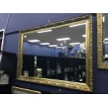 A GILT FRAMED WALL MIRROR, ANOTHER AND A PICTURE FRAME