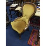 A STAINED WOOD NURSING CHAIR