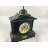 A BLACK SLATE MANTEL CLOCK