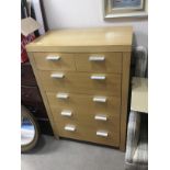 AN OAK CHEST OF SIX DRAWERS