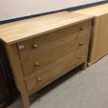 AN OAK CHEST OF THREE DRAWERS