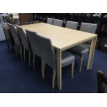 A MODERN PINE DINING TABLE AND EIGHT CHAIRS