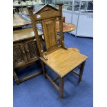 AN OAK HALL CHAIR