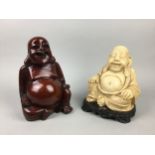 A HARDWOOD FIGURE OF A BUDDHA, ANOTHER AND A CIRCULAR WALL HANGING