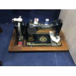 A SEWING MACHINE IN CARRY CASE