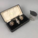 A SILVER THREE PIECE CRUET SET AND A SILVER LIDDED JAR