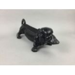 A VINTAGE CAST IRON DASCHUND DOORSTOP / BOOTSCRAPER