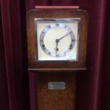 AN OAK CASED ELLIOT GRANDMOTHER CLOCK