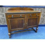 AN OAK SIDEBOARD AND DINING TABLE