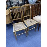 A PAIR OF CANE SEATED BEDROOM CHAIRS