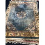 A 20TH CENTURY CHINESE FRINGED RUG AND ANOTHER RUG