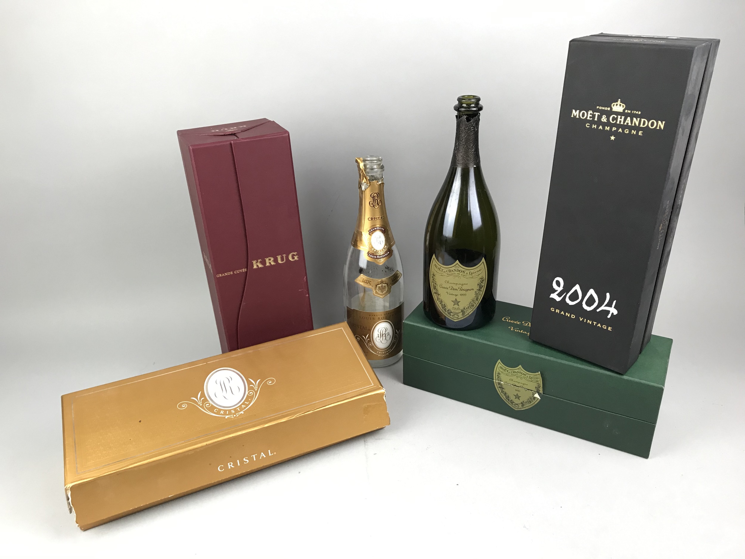 FOUR CARTONS OF EMPTY CHAMPAGNE BOTTLES