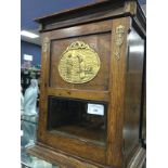 AN EARLY 20TH CENTURY OAK SMOKER'S CABINET