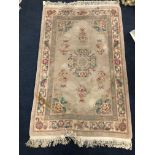 A 20TH CENTURY CHINESE RUG AND OTHER SMALLER CHINESE RUGS