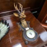 AN AMERICAN BALD EAGLE WALL PLAQUE AND A BAROMETER