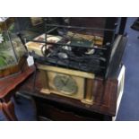 A MAGAZINE RACK AND MANTEL CLOCK, ALONG WITH OTHER ITEMS