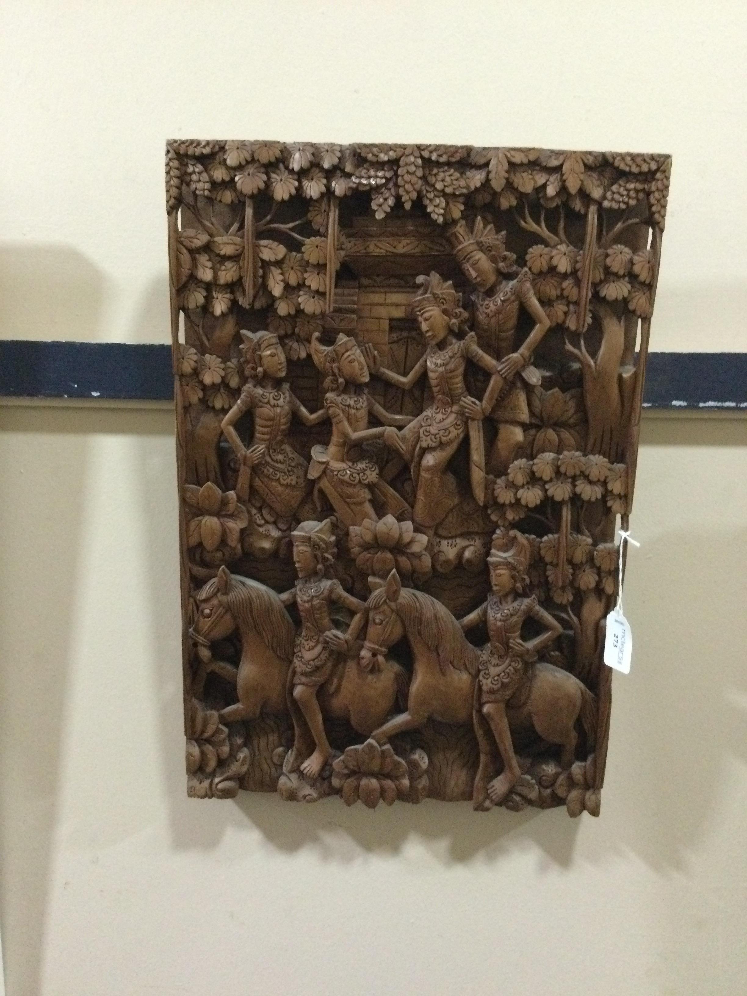 AN INDONESIAN CARVED WOOD RECTANGULAR PLAQUE