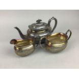 A LATE VICTORIAN SILVER PLATED THREE PIECE TEA SERVICE AND CASED SERVALLS